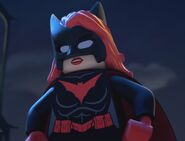 Kate Kane voiced by Tara Strong in the LEGO DC Comics Super Heroes films.