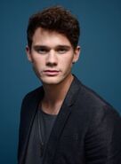 Jeremy Irvine as Jimmy Olsen