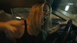 Harcourt punching her car’s dashboard
