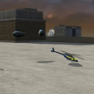 Gizmo's blimps and helicopter.png (273 KB) Two toy blimps and one toy helicopter on a rooftop