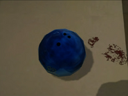 Note Frank's bloody footprint on the counter next to the bowling ball.