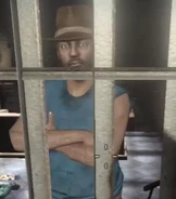 Cahaya behind his shop bars