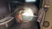 The bathroom with the woman's corpse