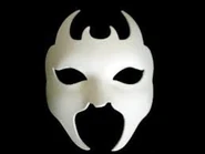 A White Devil masquerade mask.