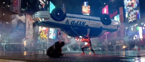 Spider-Man lifts a cop car