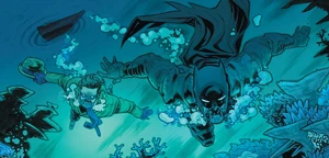Riddler swims with his breathing mask with Batman