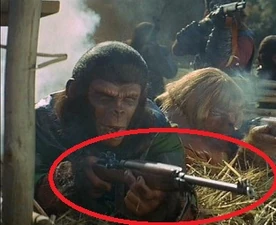 A chimpanzee soldier firing on attacking human warriors. Circled is an M1 Garand.