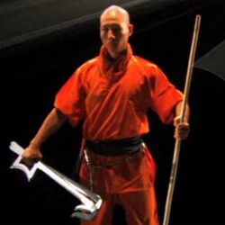 Photo of Shaolin warrior monk with a broad sword