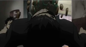 Senji gets hit with a flower pot.