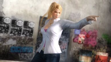 Sarah Bryant: A white shirt with a pink tank top underneath, a gold "K" pendant, blue jeans, a white belt and brown heeled boots.