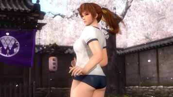 A gym kit for Kasumi consisting of a white t-shirt with dark blue hems, dark blue short-shorts, gym socks and running shoes. Her name is written in Japanese on the name tag across her chest.