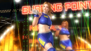 Tina Armstrong: Blue spandex wrestler suit with "DWA" written in yellow on the chest and on the side of the legs, white gloves and boots and blue pads.