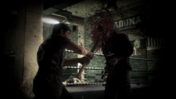 Nick kills a zombie with the sledgehammer.