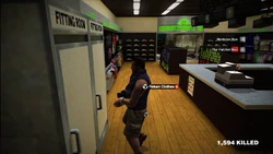 Blue Vest with Tan Shorts is found in the back corner of the store.
