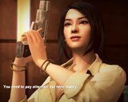 Rebecca Chang holds the pistol
