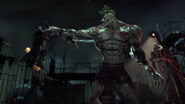 As Titan Joker, a form achieved by using the Titan compound as he lifts Batman with a single hand.