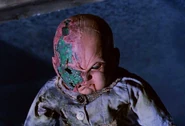 Baby Oopsie Daisy with half her face burned off in Demonic Toys (1992)