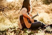 Katy playing guitar