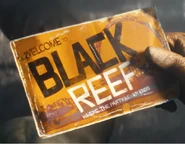 A pamphlet for Black Reef, as shown in the teaser trailer.