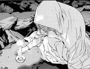 Kira worshiper puts down candle.jpg
