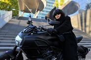 Ryuzaki riding a Ducati Diavel