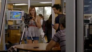 The LGBT mixer is advertised on the television in the background.
