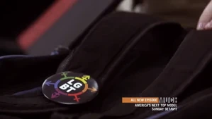 Adam's LGBT pin on his bag.