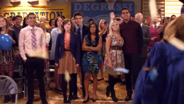 Dallas and the rest of the Class of 2013 watches as the recent graduates celebrate.