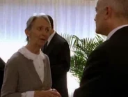 Mrs. Cooney talking to the minister.