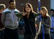 Darcy and Jane participating in the Archery Club.