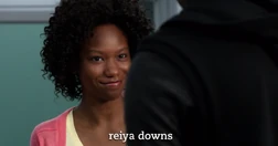 Shay smiling at Tiny after he compliments her intelligence