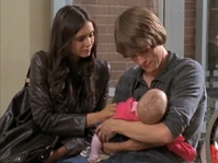 Peter holding his baby sister.