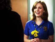 329px-Holly J In Her Degrassi Uniform Looking At Fiona With Three Yellow Flowers In Her Hand