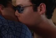 Miles and Tristan share a kiss.