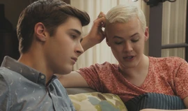 Tristan talking to Miles on his couch.