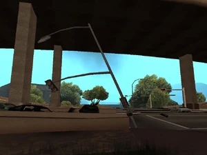 Abgerissene Ampel die im Boden steckt