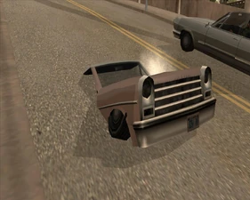 Ein Auto steckt im Boden fest.