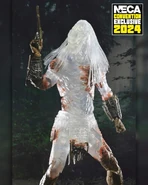 La figura Ultimate Feral "Camo Reveal" Predator con la pistola de chispa