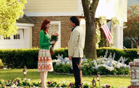  surprises Bree with a bouquet of flowers.