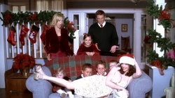 The Scavo-Huntington family pose for their Christmas card photo in season three.