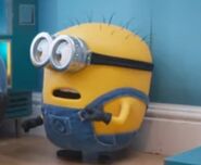 Short and plump minion with slanted spiky hair.