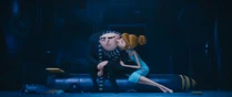 Lucy kissing Gru.
