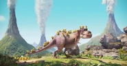 The Minions riding on the T. rex