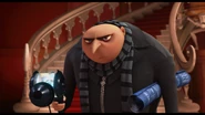 Gru fires the freeze ray at Vector.