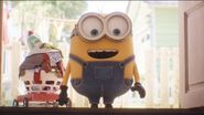 Short and small minion with two strands of hair and blue eyes
