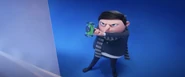 Gru using the sticky fingers.