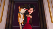 Corgi licks Scarlet's face