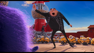 Gru brandishes the lipstick taser after disabling El Macho.