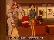 Dressed up as a busboy, Kaitou Kid takes Ran's dress and duplicates it right before the showdown between him and Conan on the ship.