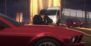 Shuichi Akai sniping from the hood ofhis red Mustang.